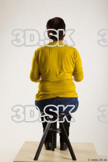 Sitting reference of yellow sweater blue jeans Gwendolyn 0011